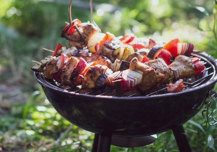 kangaroo skewers on an outside mini barbecue grill